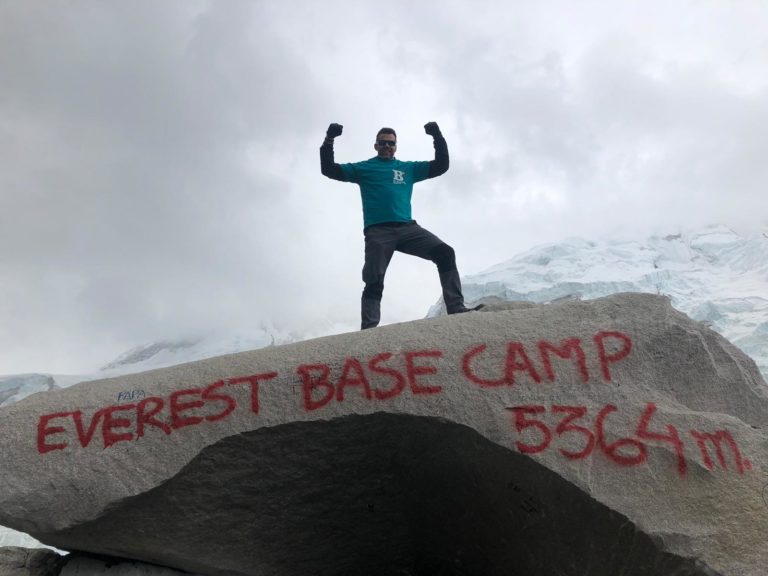 Man celebrating at Everest base camp