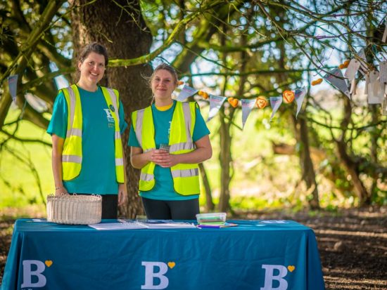 Two volunteers at a St Barnanbas House event