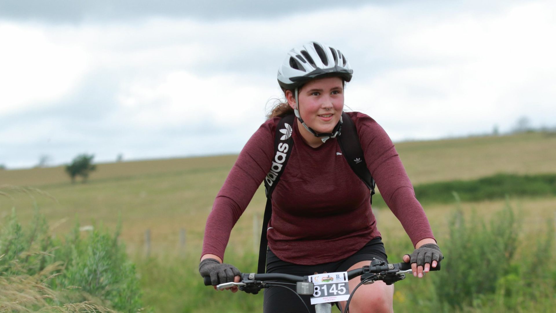 Image of young woman on a mountain bike