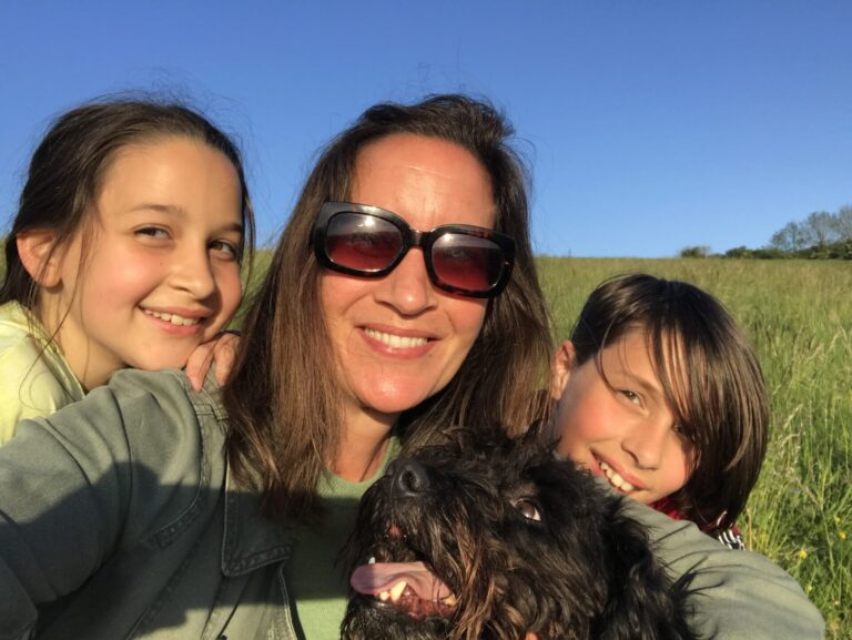 Polly and her family taking a selfie in the sun