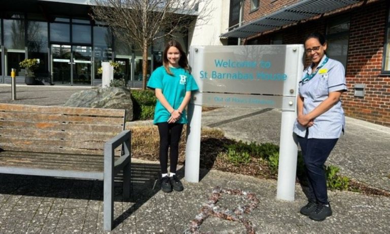 Image of Lola and a St Barnabas nurse outside the hospice