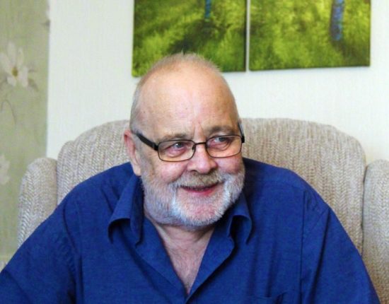 Smiling man with glasses