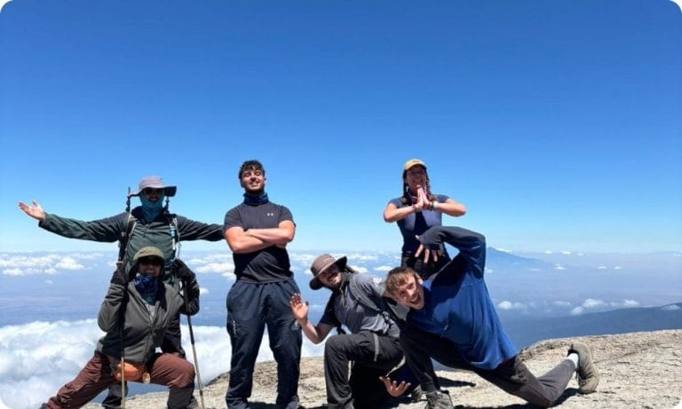 Six friends at the top of Kilimanjaro