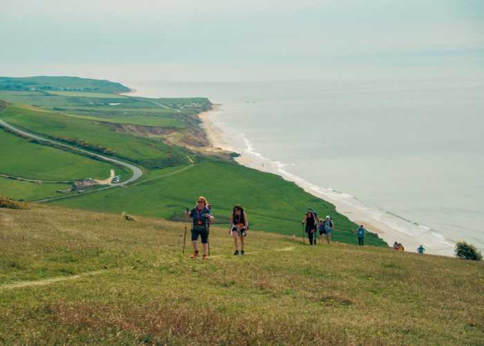 walkers hiking along the cliffs of the Isle of Wight