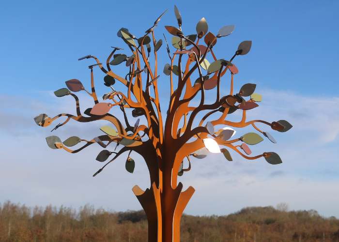 a metal hospice memory tree with leaves in bronze, silver and gold