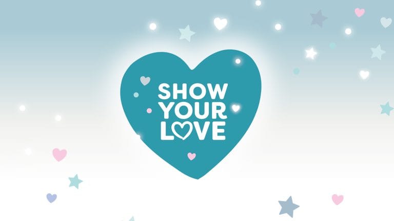 A blue heart on a background of hearts and stars. It reads 